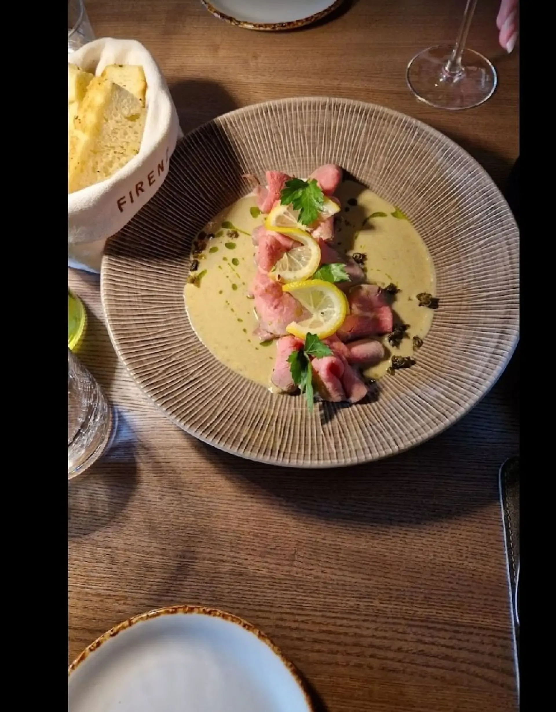 Served in a tuna fish sauce with hints of caper and anchovy.I believe is one of